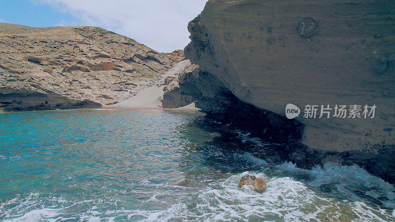 Aerial view of the hidden cove beach "La Rajita" at the natural reserve of "Monta?a Pelada" in Tenerife (Canary Islands). Drone shot